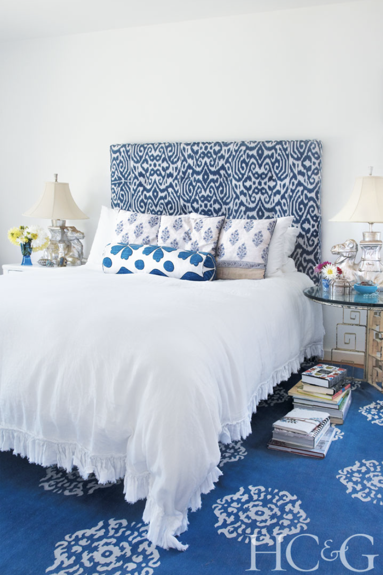 Photographs by Marili Forastieri; In the bedroom, camel lamps from Mary Ann Lembo sit atop a pair of American 1940s side tables. Weinrib's Luce ikat covers the headboard.