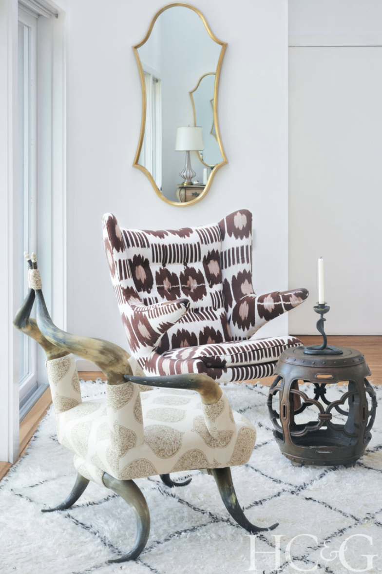 Photographs by Marili Forastieri; A Victorian horn chair and a vintage Hans Wegner armchair command attention in a corner of the living room.