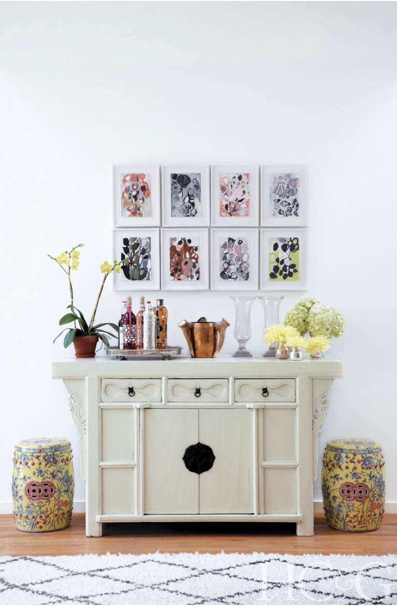 Photographs by Marili Forastieri; A suite of gouaches by Weinrib hangs above a Chinese console from ABC Carpet & Home.