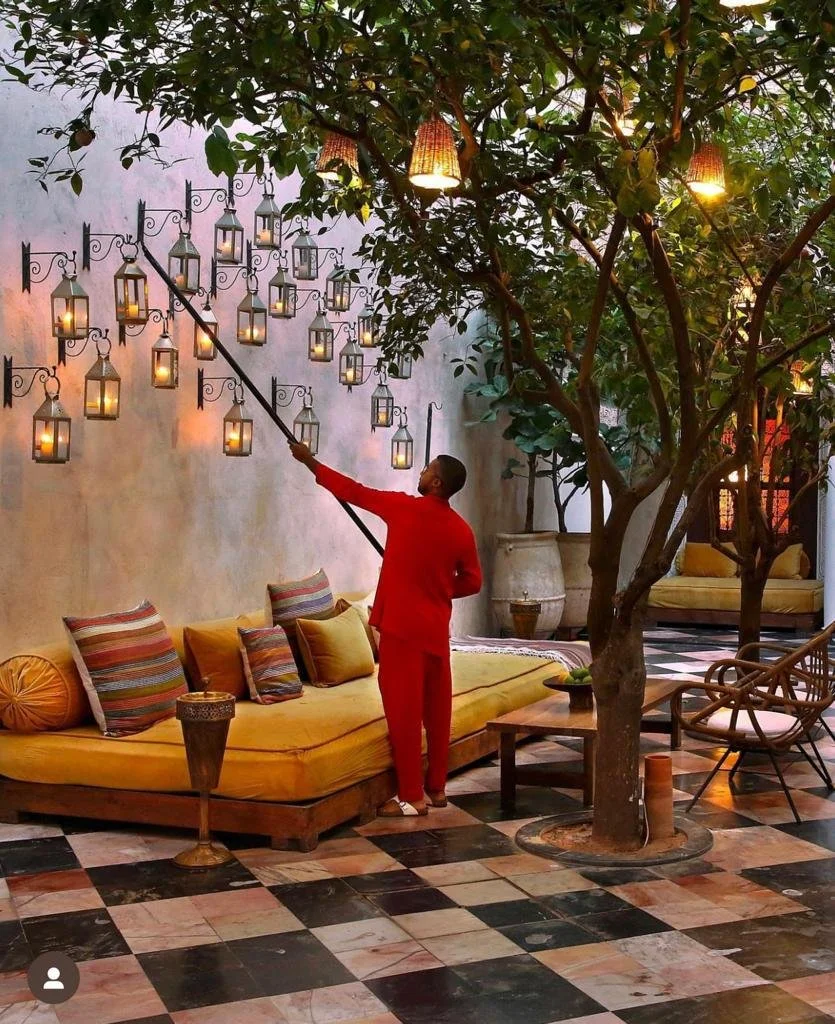 Orange Courtyard 2022 lighting candles.JPG