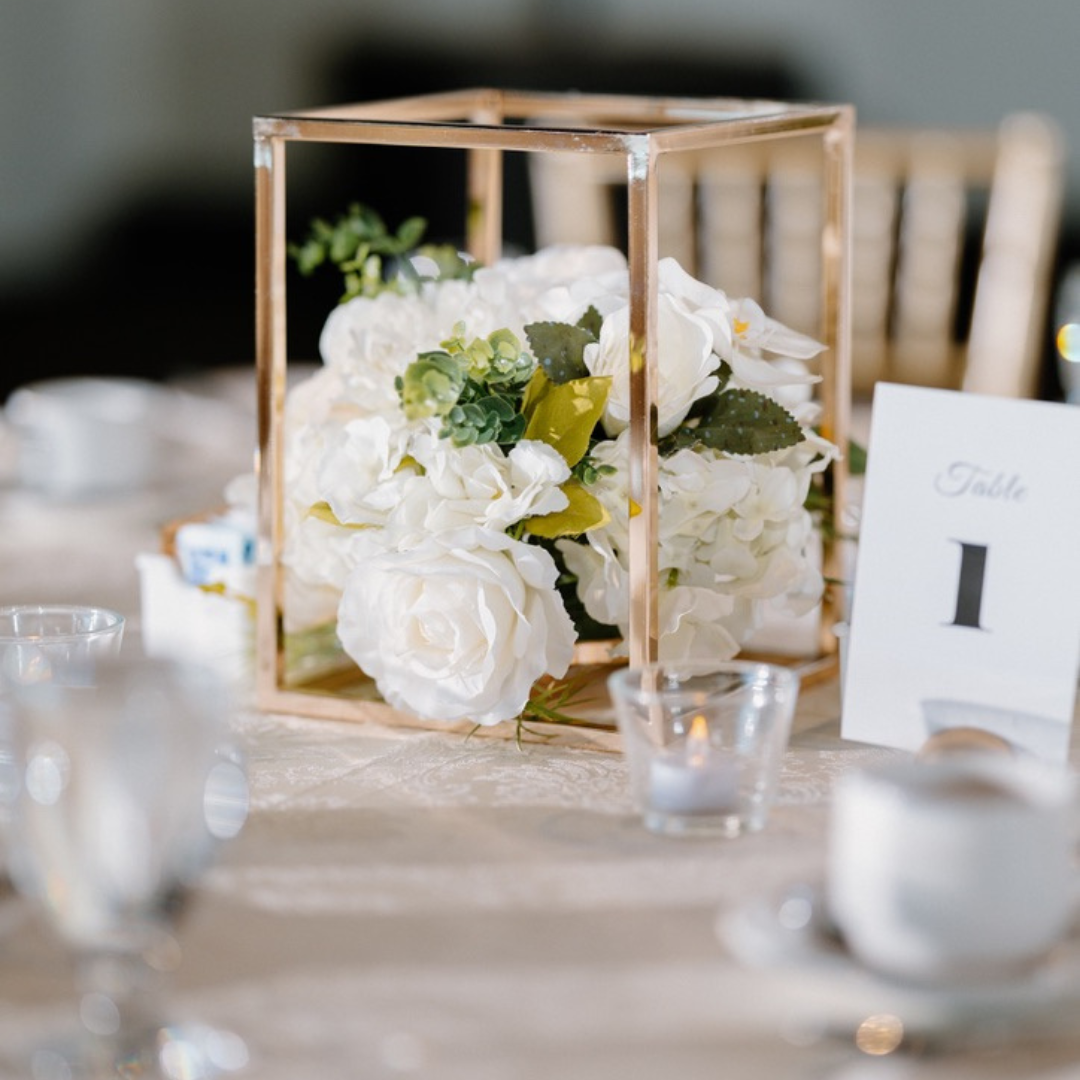 Elegant outdoor proposal setup with a red rose in a vase and an oil lamp on a white tablecloth, creating a romantic and intimate atmosphere planned by Aurelia Weddings and Events in Europe.