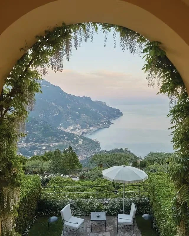 Arched garden terrace overlooking the Amalfi Coast from a luxury hotel in Ravello, Italy