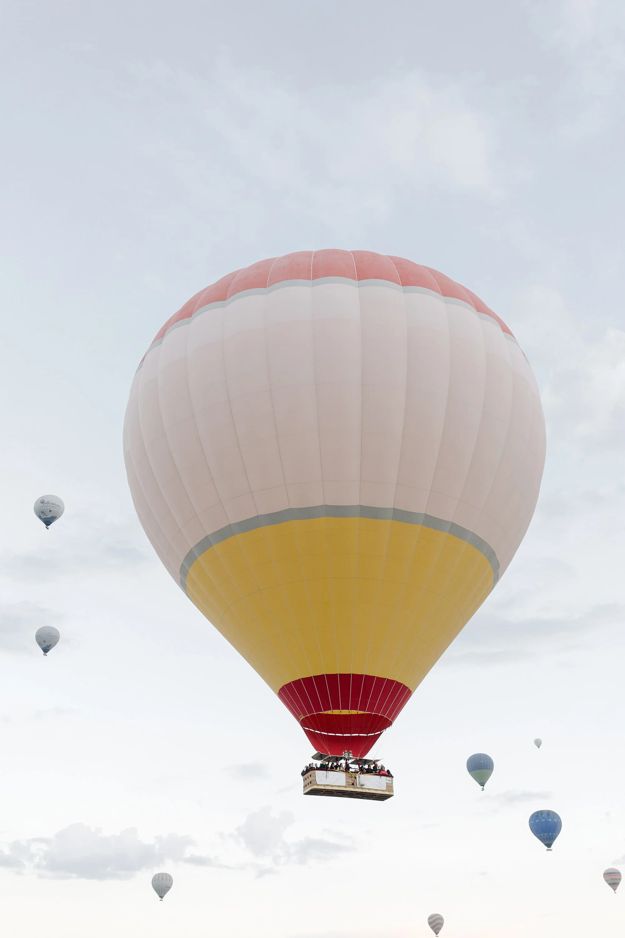A hot air ballon where group is celebrating a friends birthday.