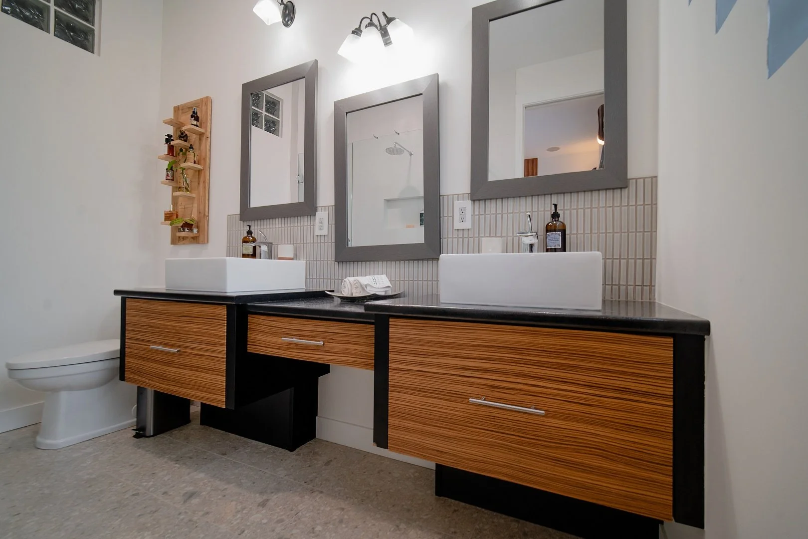 Image of a WorkPro Contracting bathroom renovation featuring wide floating bathroom countertops and double sinks