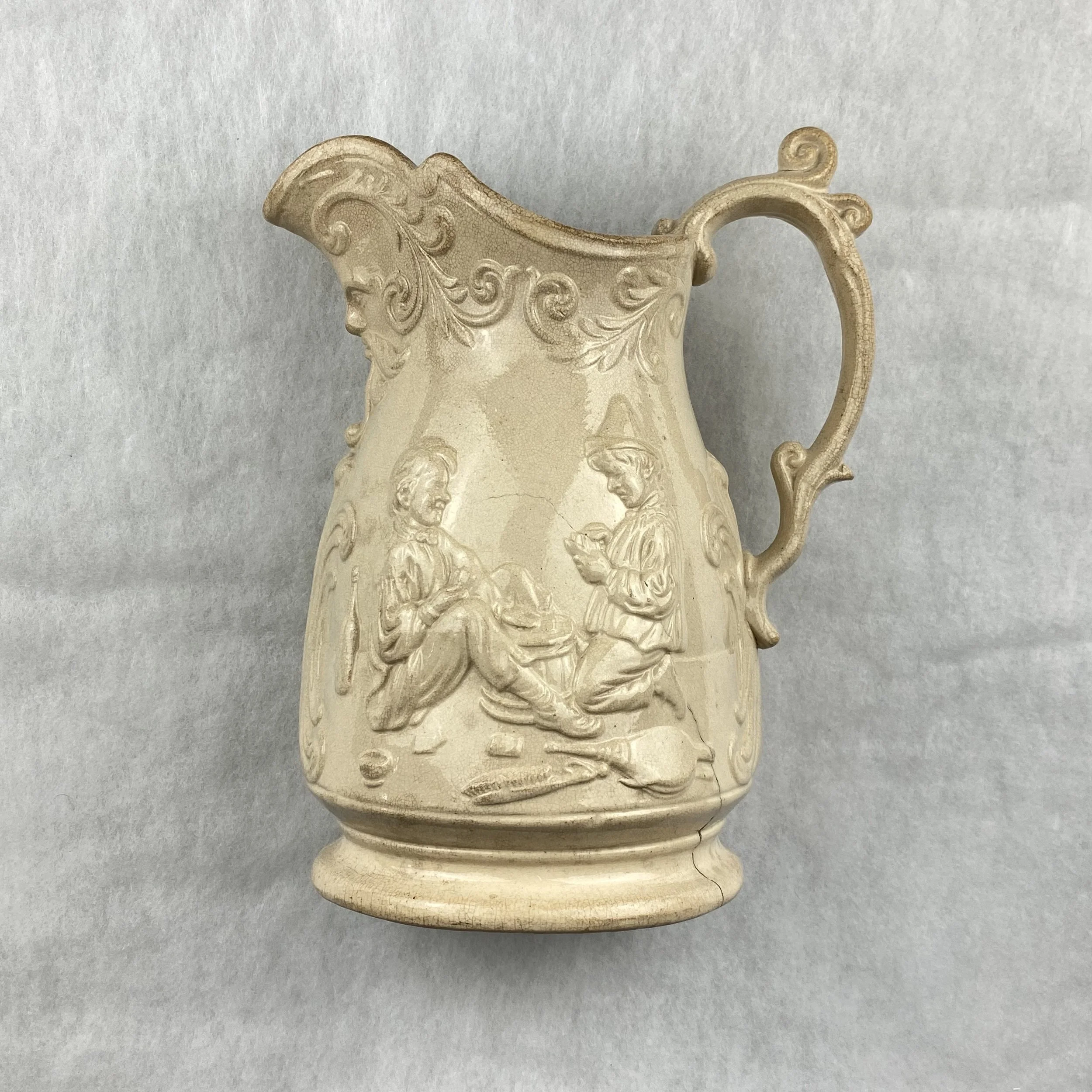   GAY object 037  19th century 'Idle Apprentice' jug featuring the face of Bacchus below the spout 