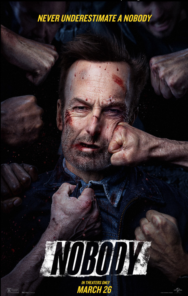 A man with a serious expression is being punched by multiple fists, with blood on his face. The background shows aggressive figures. Text at the top reads "Never Underestimate a Nobody" and at the bottom, "NOBODY" with a release date of March 26.