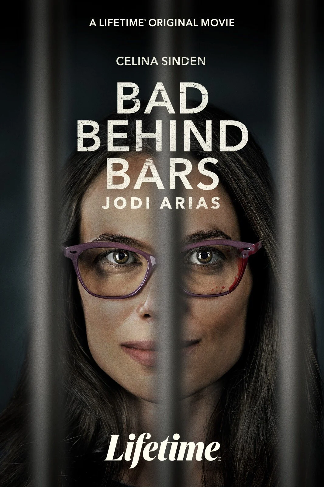 Promotional poster for the original movie 'Bad Behind Bars' starring Celina Sinden and Jodi Arias, showing a woman's face behind jail bars, wearing glasses, with a serious expression.