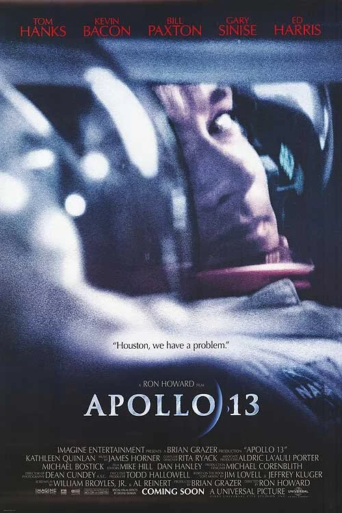 Poster for the movie Apollo 13 featuring actors Tom Hanks, Kevin Bacon, Bill Paxton, Gary Sinise, and Ed Harris, with the tagline "Houston, we have a problem."