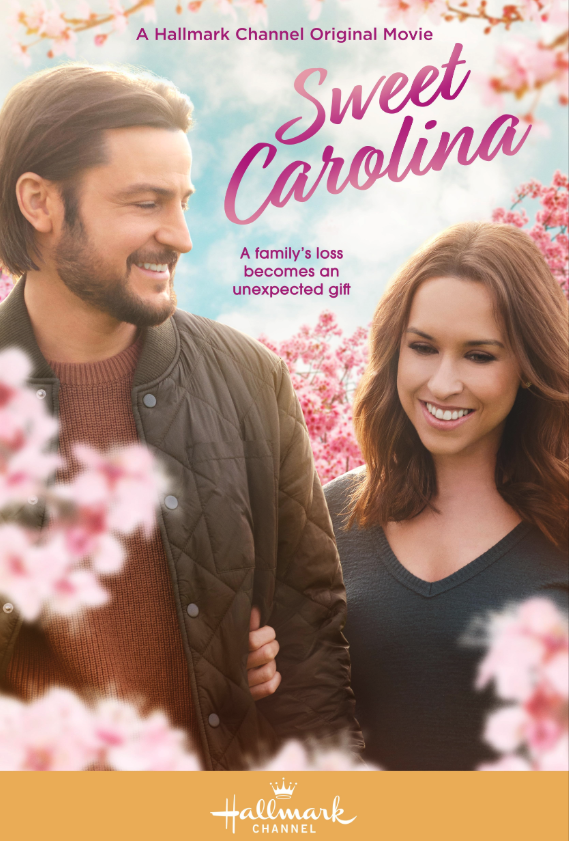 Movie poster for 'Sweet Carolina' showing a man and woman smiling outdoors with pink blossoming trees in the background.