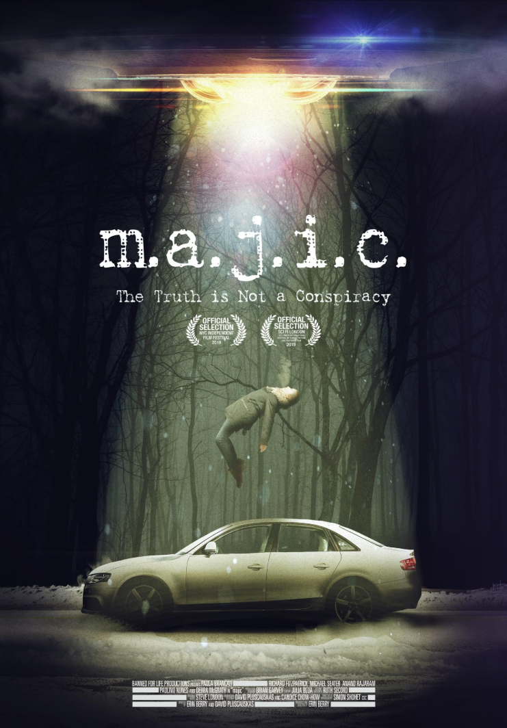 A dark, eerie forest scene with a silver car on the ground and a man floating upside down above it. Light beams shine through the trees, illuminating the scene. The text reads 'm.a.j.i.c.' with the subtitle 'The Truth is Not a Conspiracy' and include