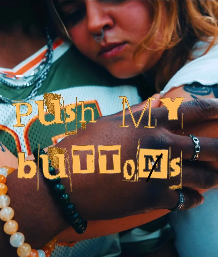 Close-up of two people, one with a nose ring, with the text "Push MY buttons" overlayed on the image.
