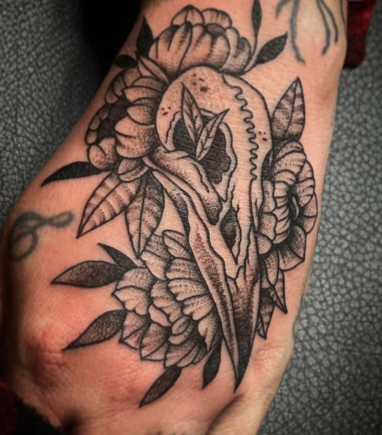 hand tattoos for women blackwork floral with animal skull Jocelyn Groff