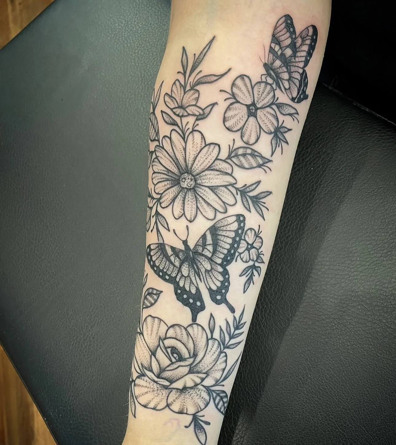 butterfly and birth flower black and grey tattoo in Rensselaer New York