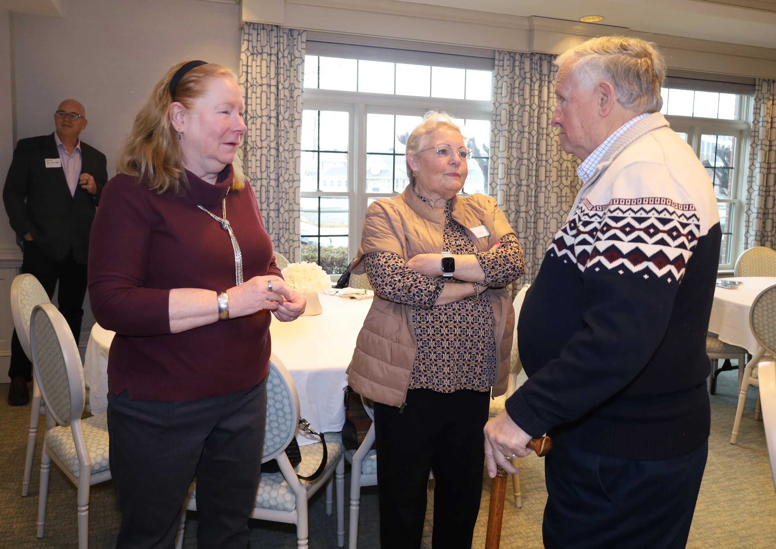 CSTC supporters Sandra Humphrey (left) and Al Willis (right) talk with board member Kim Mason (center).