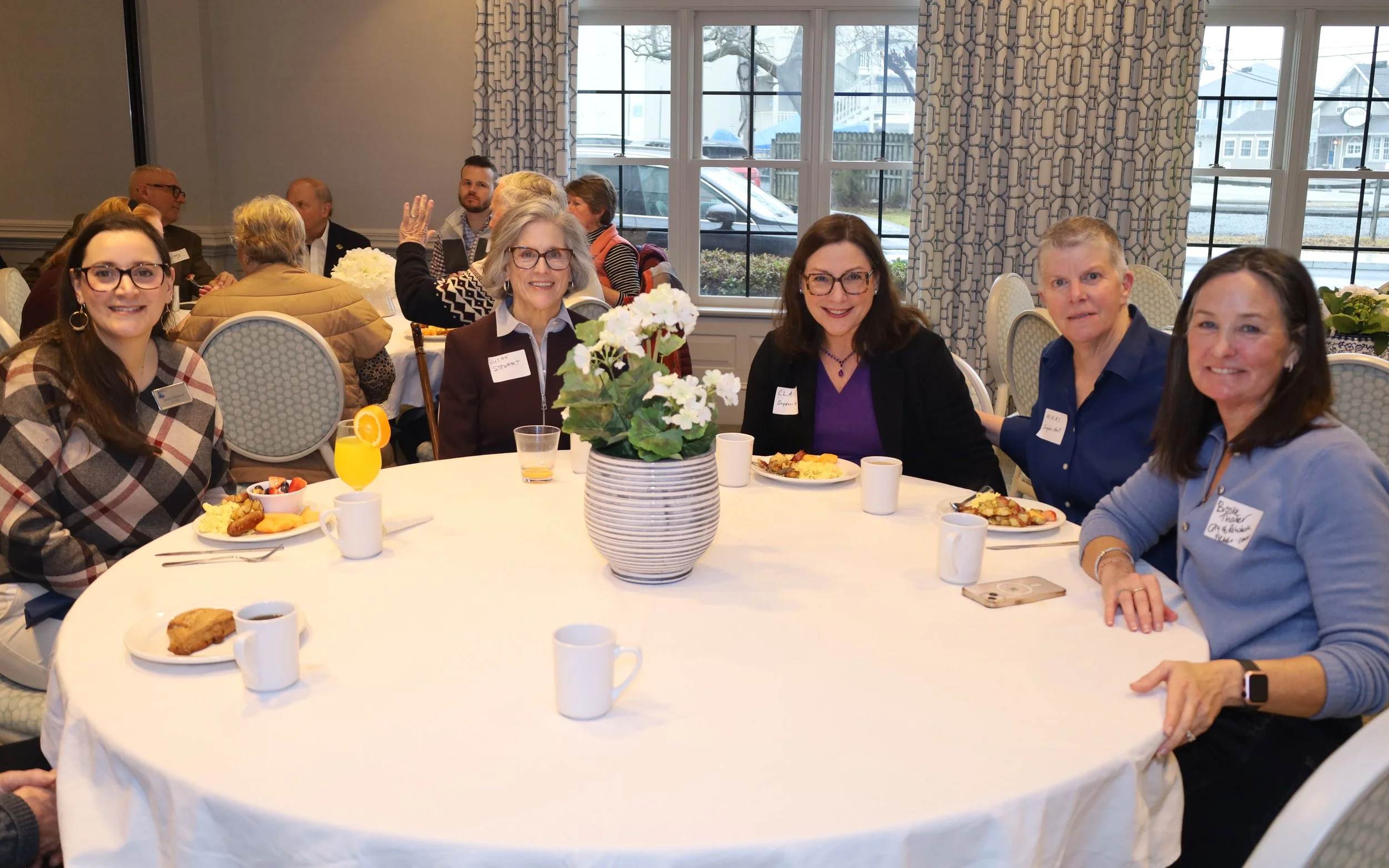 CSTC board secretary Laura Howard seated with Rehoboth Beach Commissioner Susan Stewart, State Representative Claire Snyder-Hall, Mikki Snyder-Hall, and Rehoboth Beach City Communications Manager Brooke Thaler.