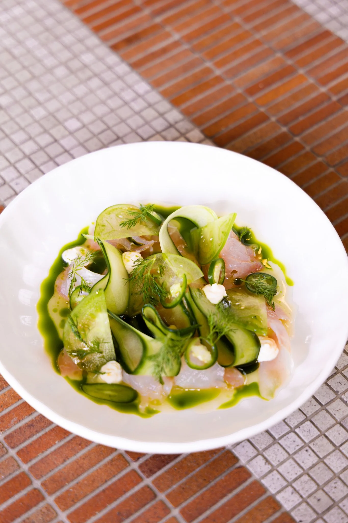 Trevally crudo with cucumber, green chilli and herb dressing at La Zeppa.