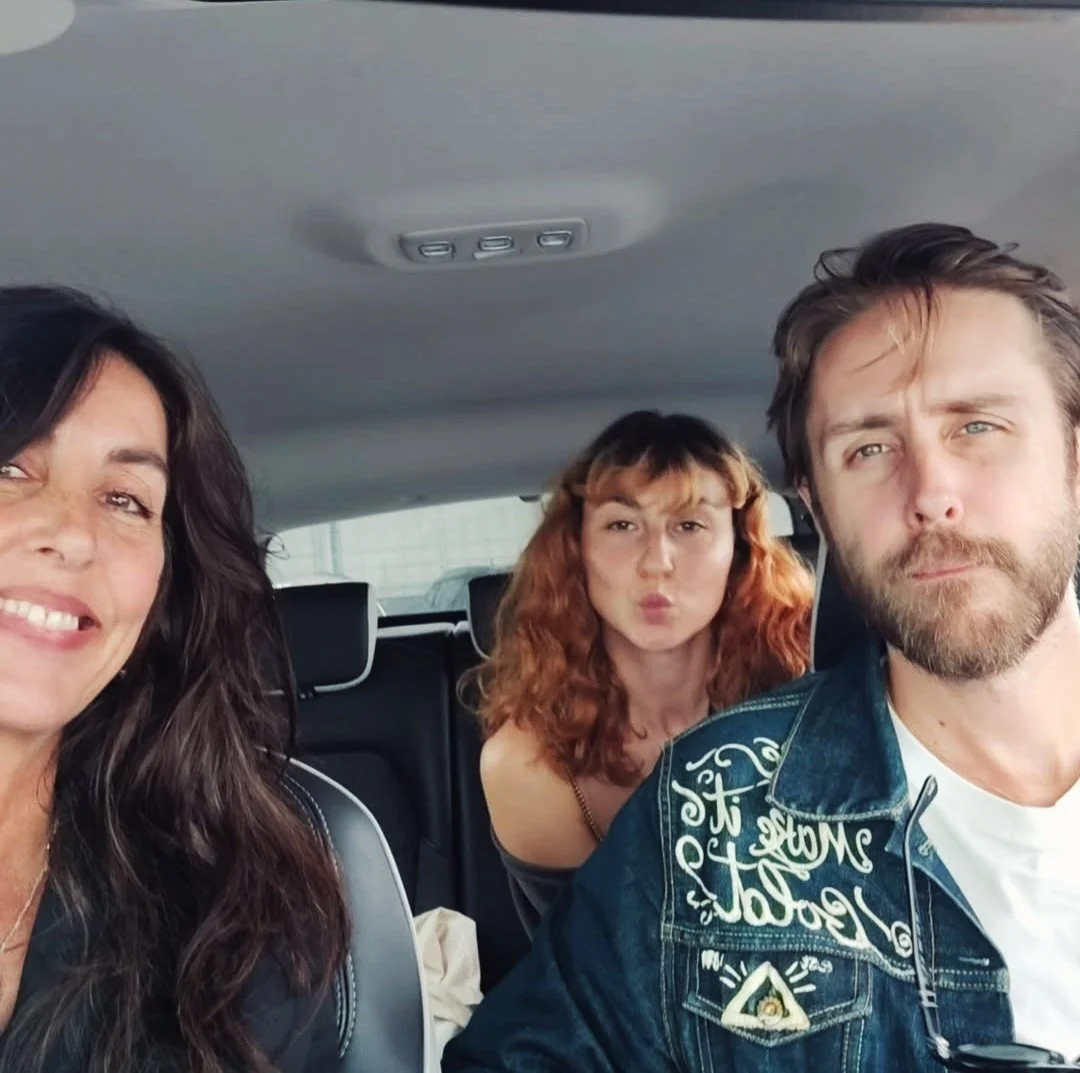 Three people taking a selfie inside a vehicle in Porto, Portugal, two women and one man, actors, dancers, photographers, eager to start their new fashion brand Lucchini Moon.