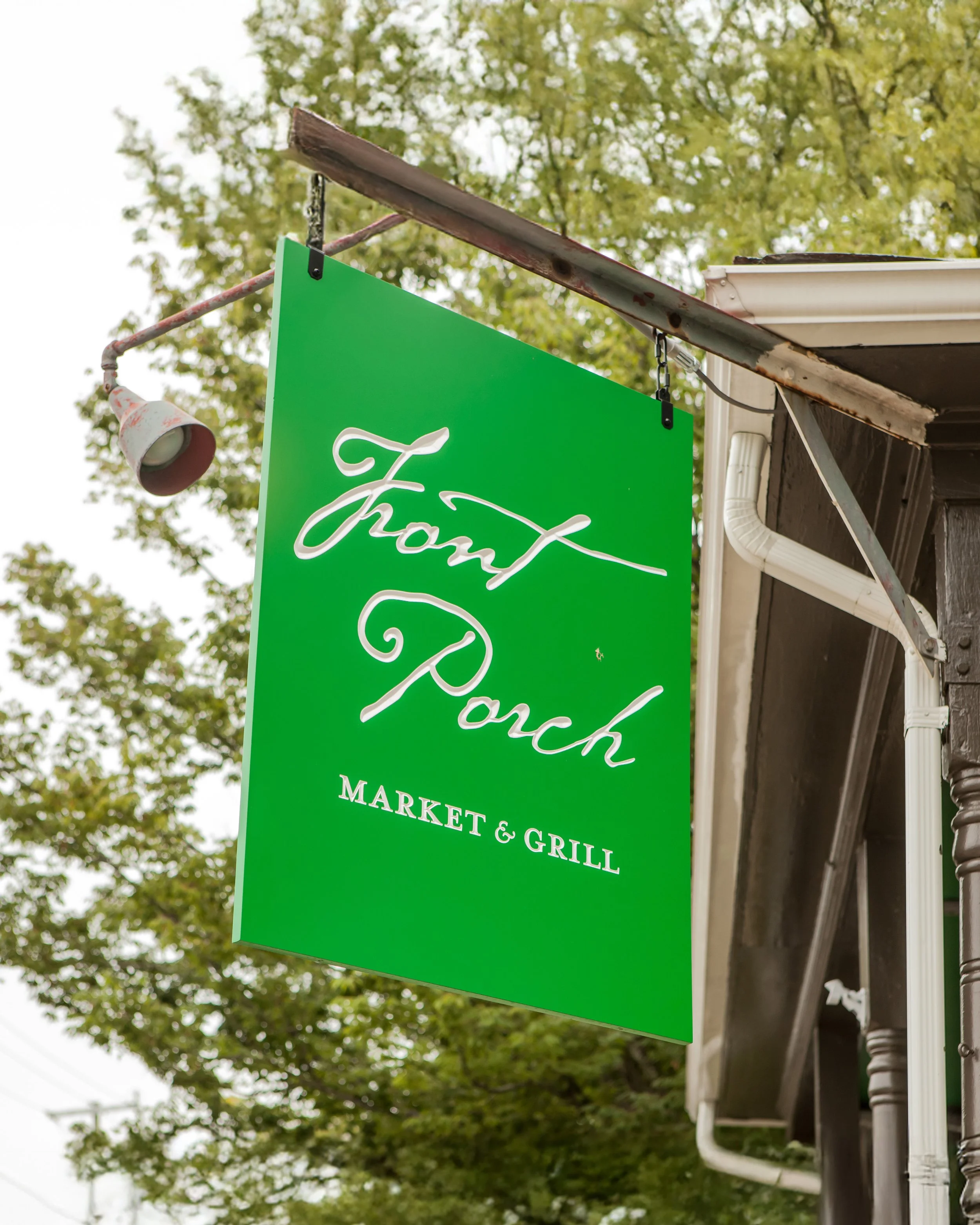 The front sign of front porch, a commercial market and grill designed by McClennan Architects.