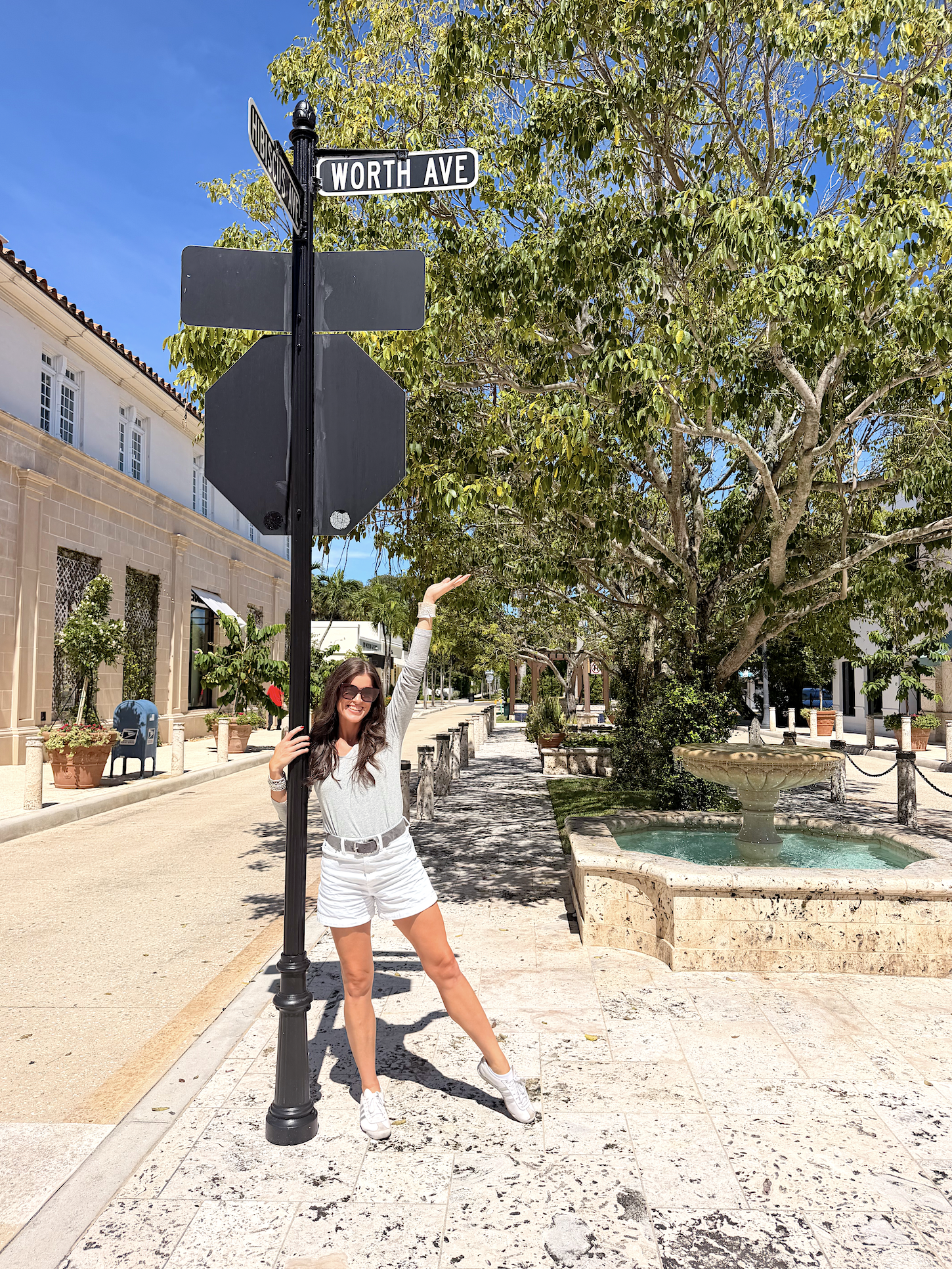 Victoria standing in front of Worth Ave sign