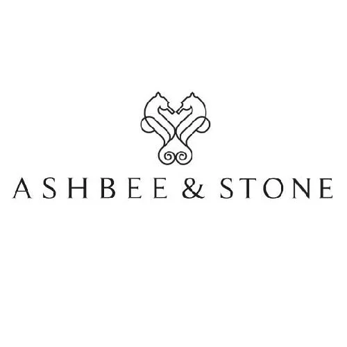 Logo with a symmetrical decorative design above the text 'ASHBEE & STONE' in elegant font.