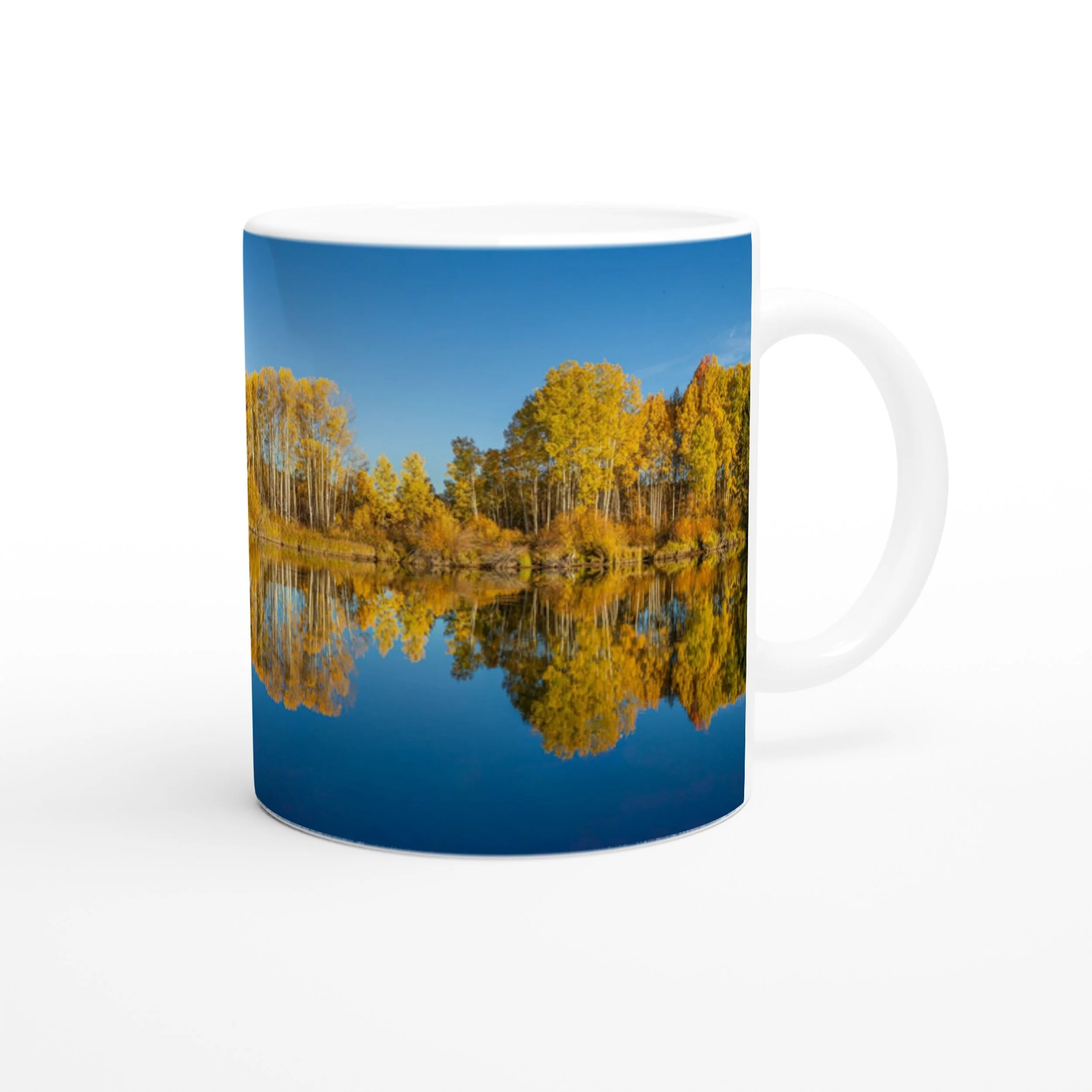 Autumn Deschutes River photo side of the white ceramic mug on a white background.