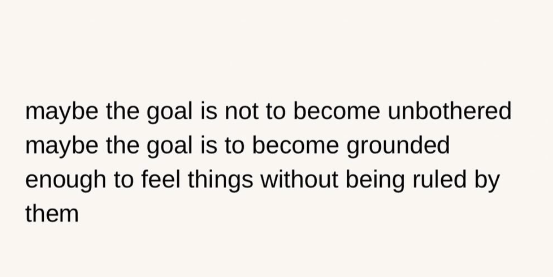 pink background with black writing: Maybe the goal is not become unbothered. maybe the goal is become grounded enough to feel things without being ruled by them.