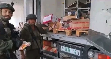 Israeli soldiers destroying aid in Gaza