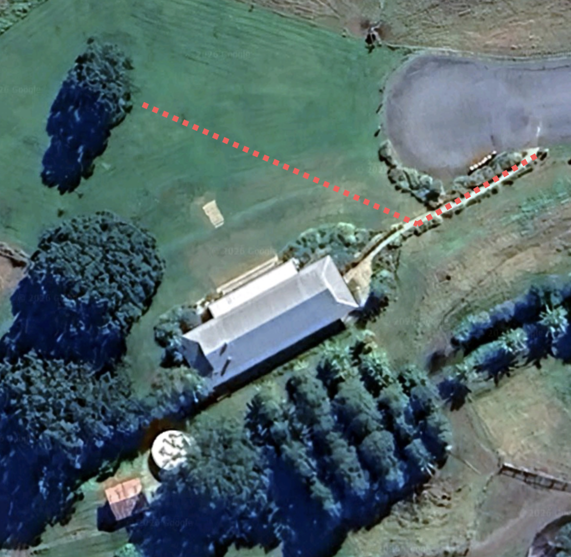bridal entrance across gentle lawn slope to lower terrace ceremony site
