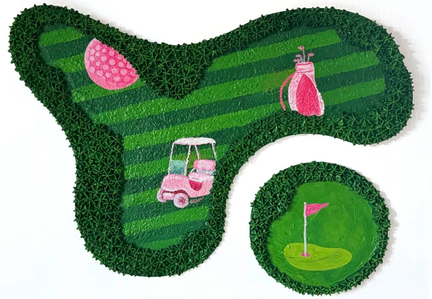 Decorative golf-themed cake with green frosting, pink and white golf cart, pink golf bag, and pink flag on a golf green.