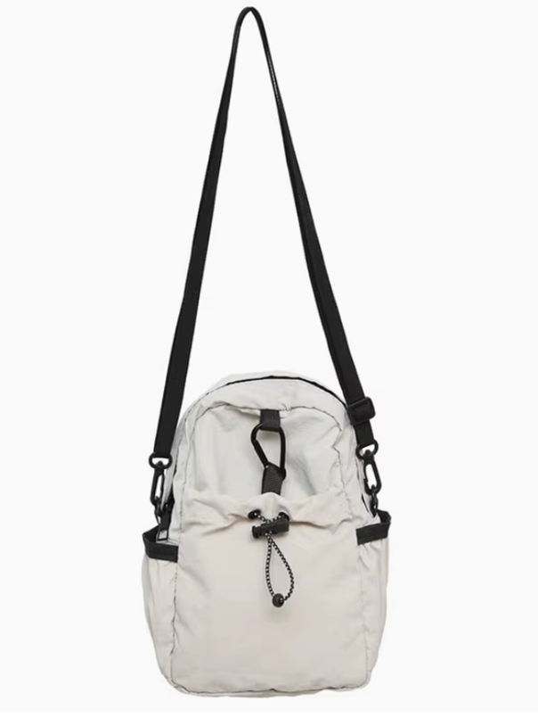 cream nylon bag.png