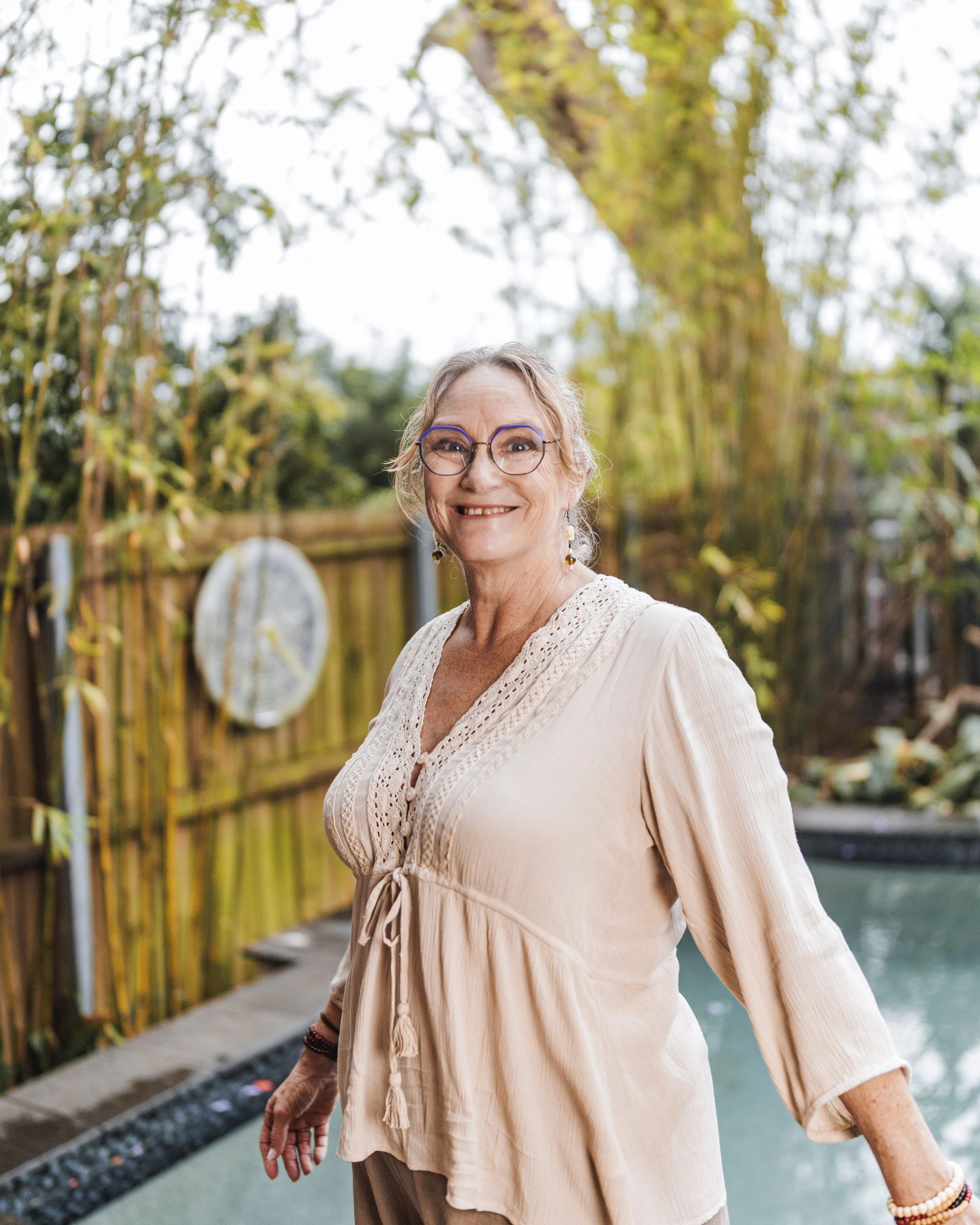 Shannon standing poolside smiling