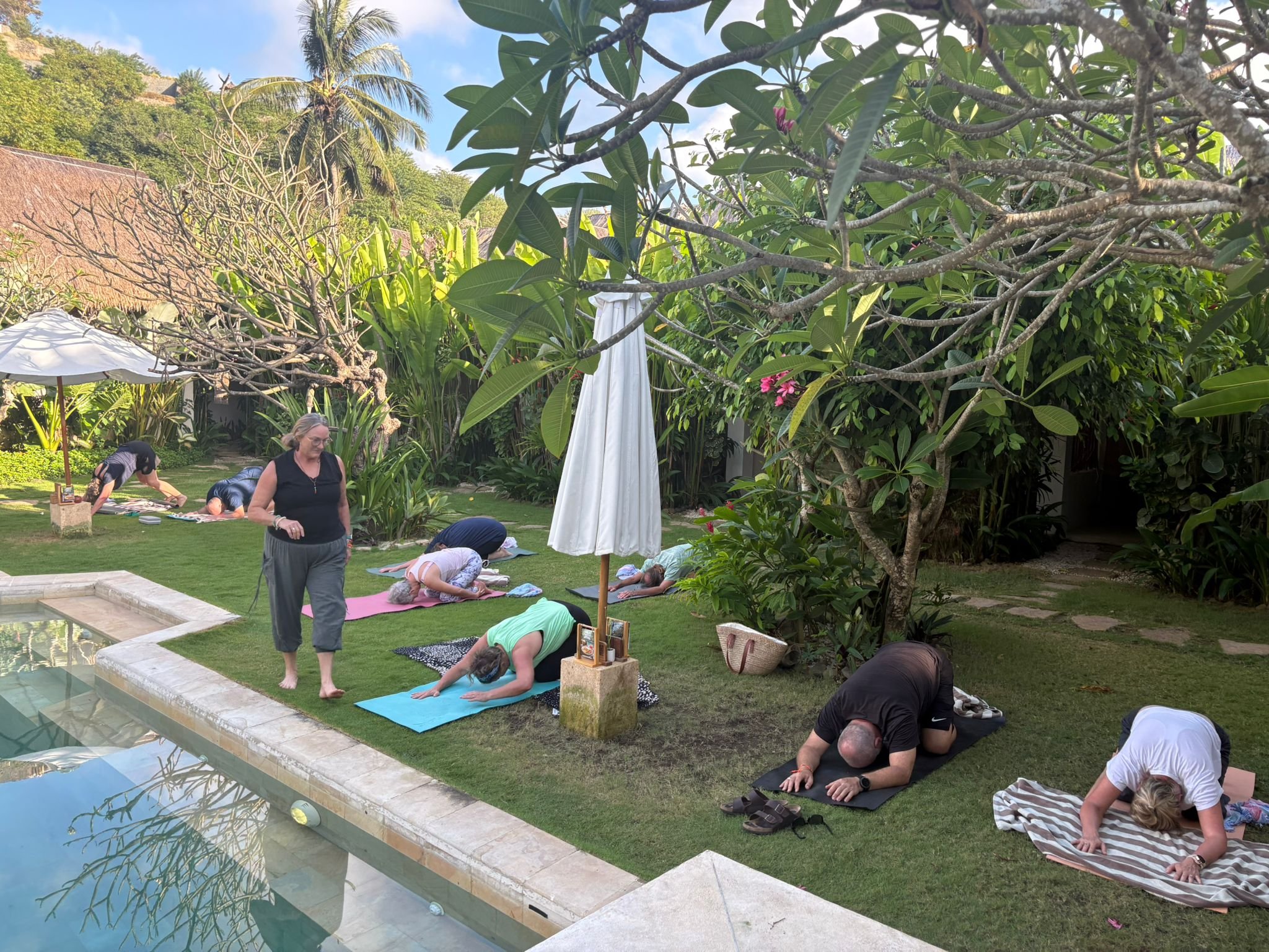 shannon teaching yoga class where students are in childs pose