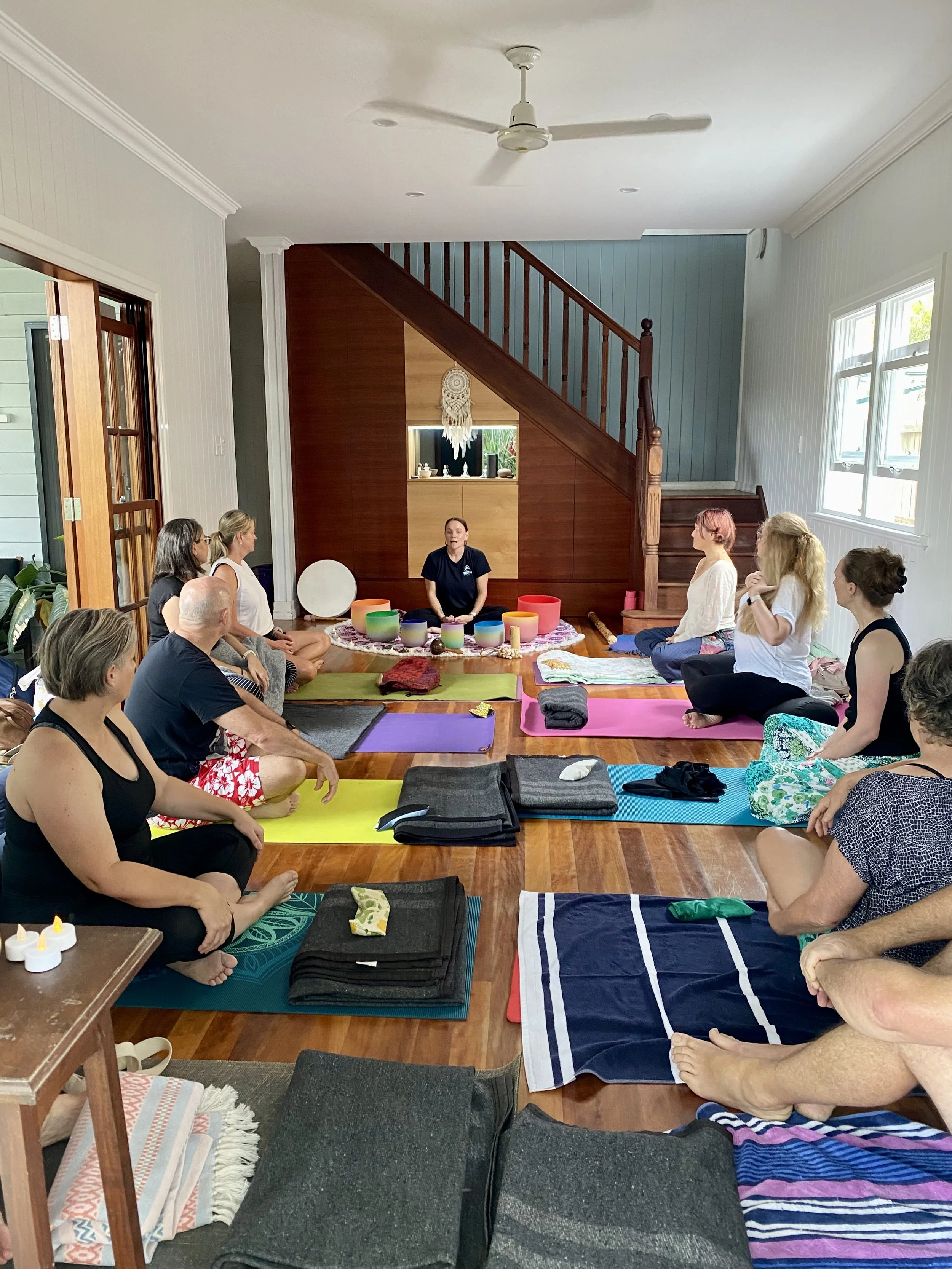 A group of yoga students in the home studio