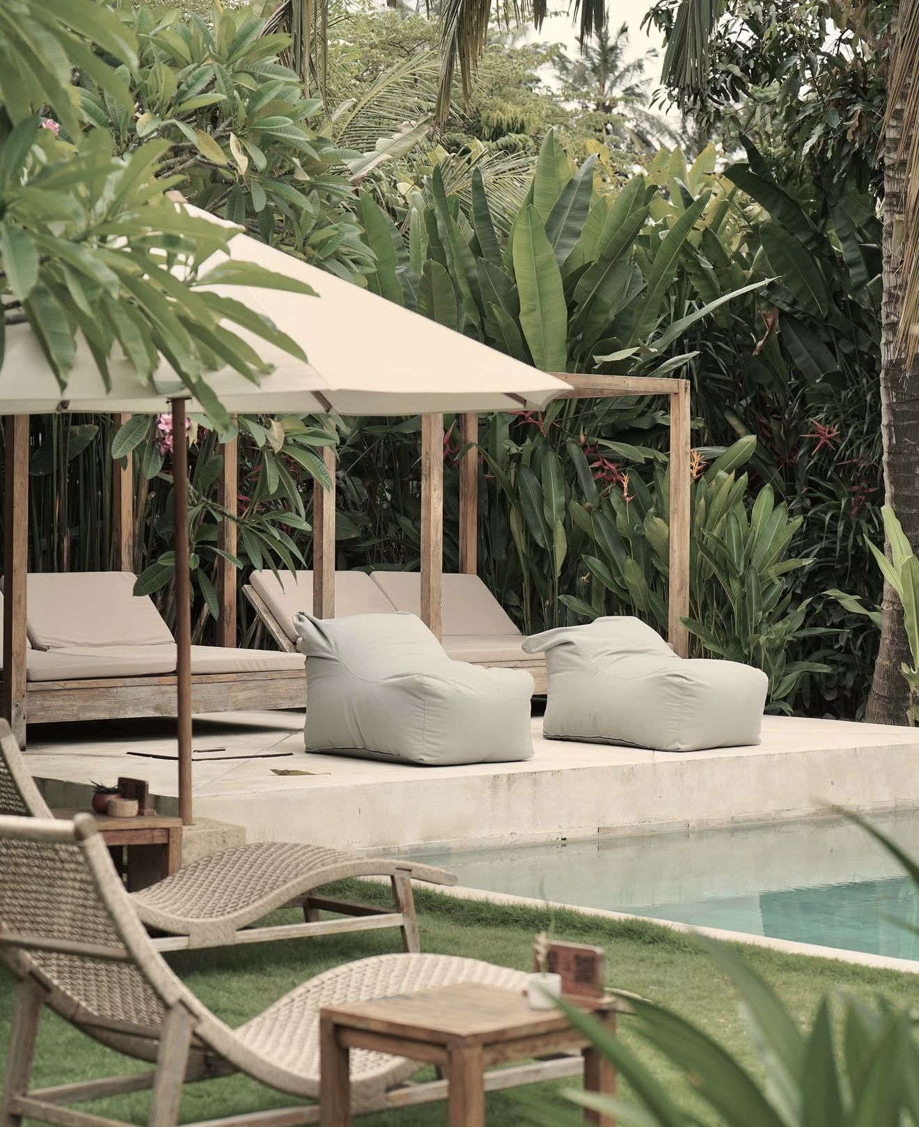 gorgeous poolside cabana with sun lounges
