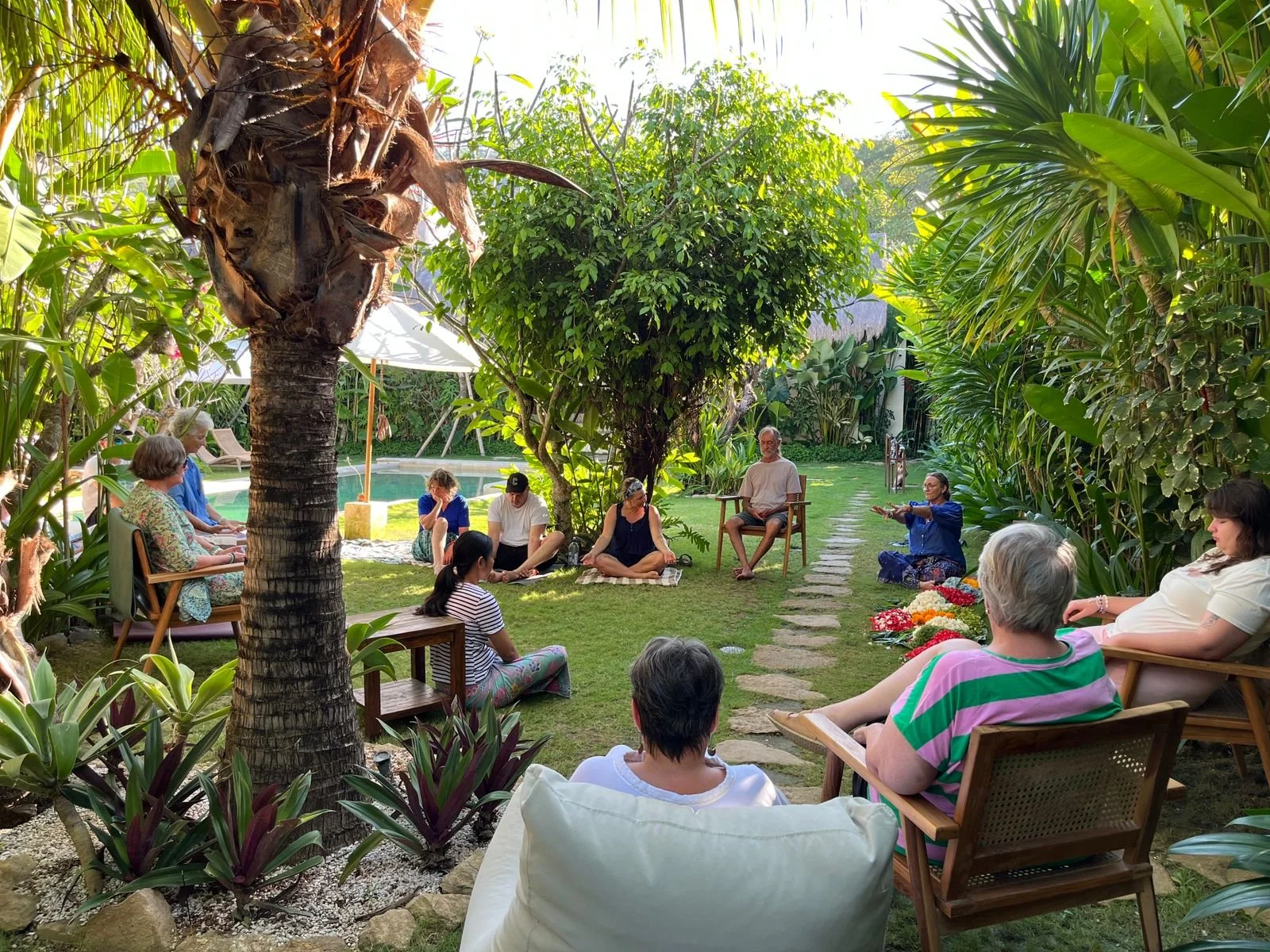 a group of middle aged people sitting in circle