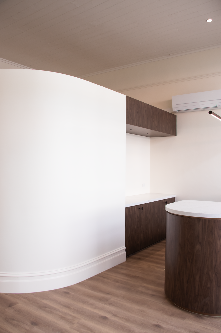 Front Reception with Curved Wall and built-in Credenza