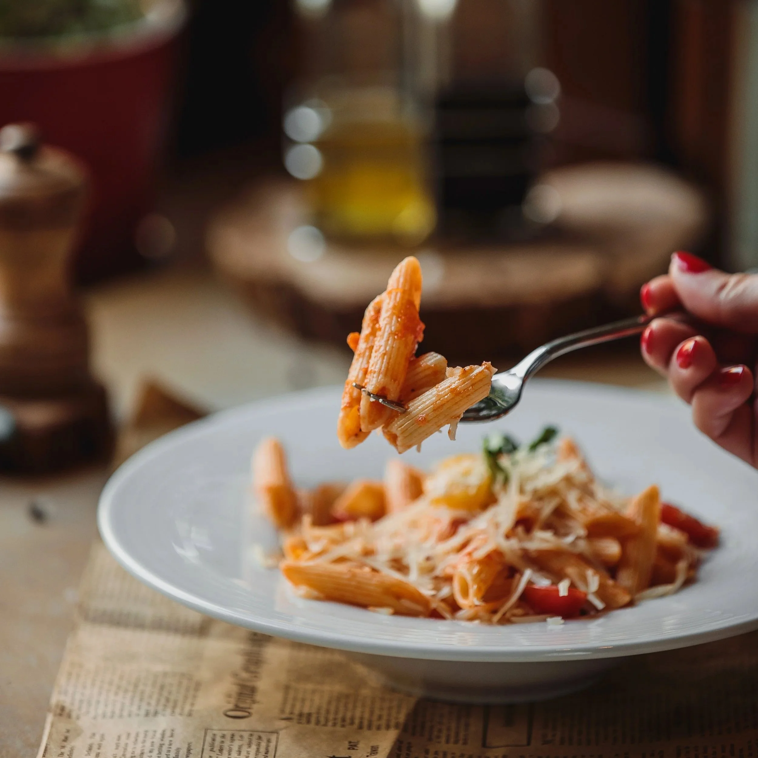 lateral view fork with pasta tomato sauce