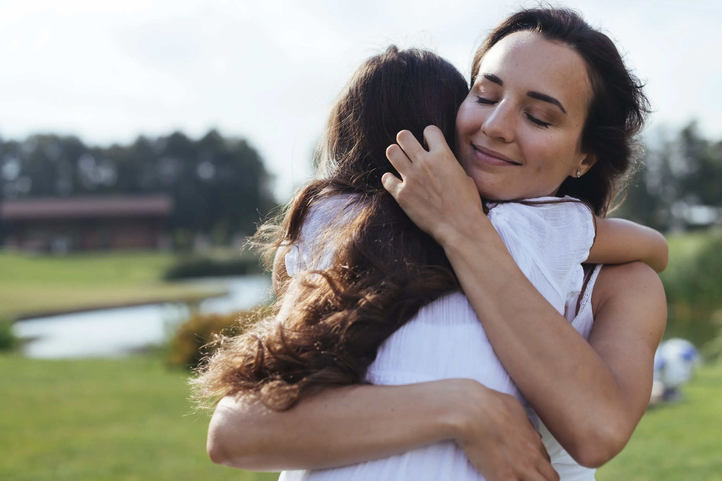 mother hugging daughter