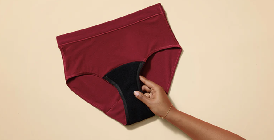 red and black woman underwear and hand