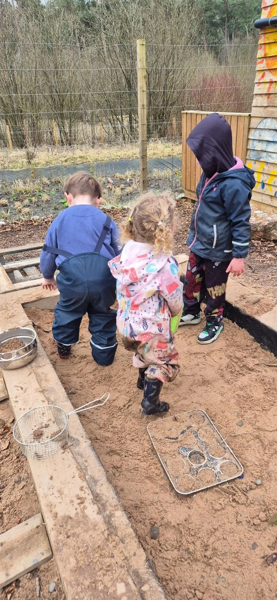 3-5 playing in sand.jpg