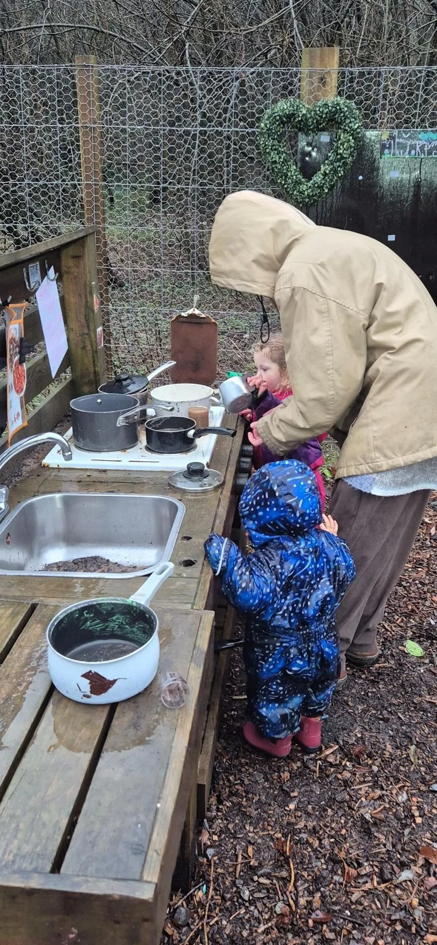 3-5 mud kitchen in rain.jpg