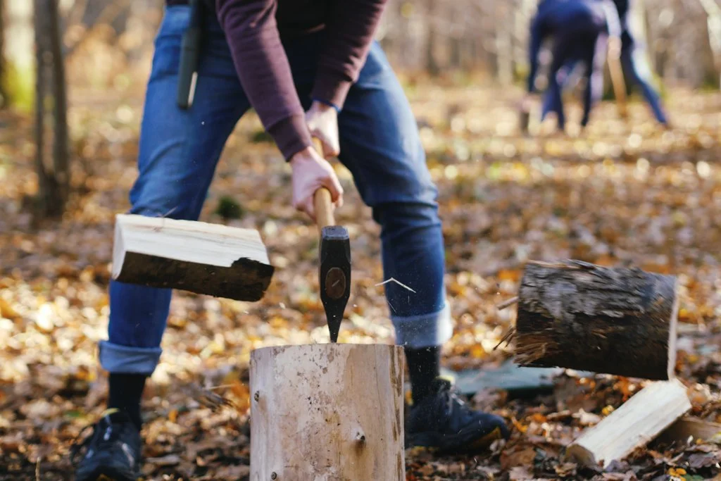   Splitting firewood with a maul.  