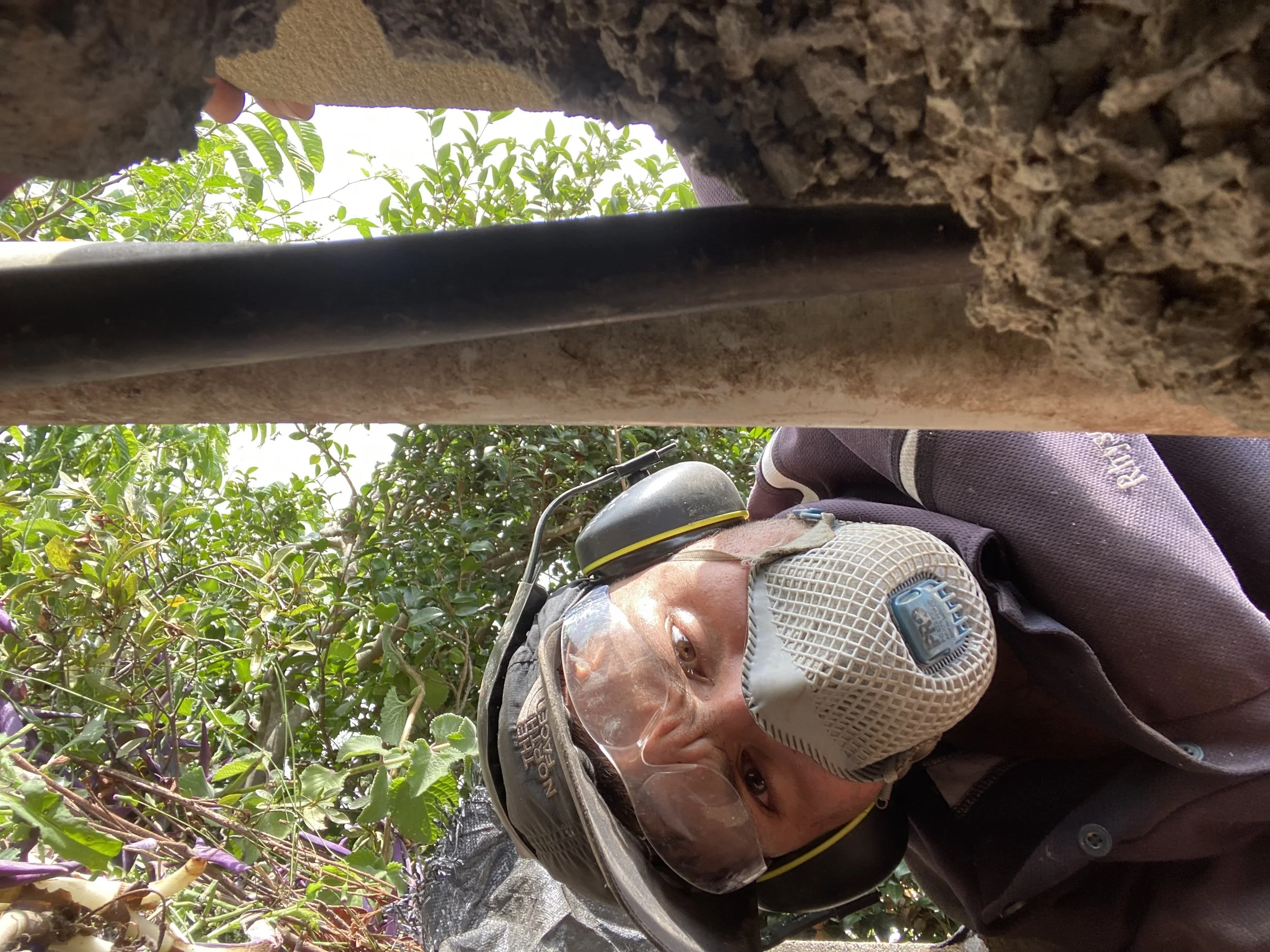 Oranssi technician working on a roof project