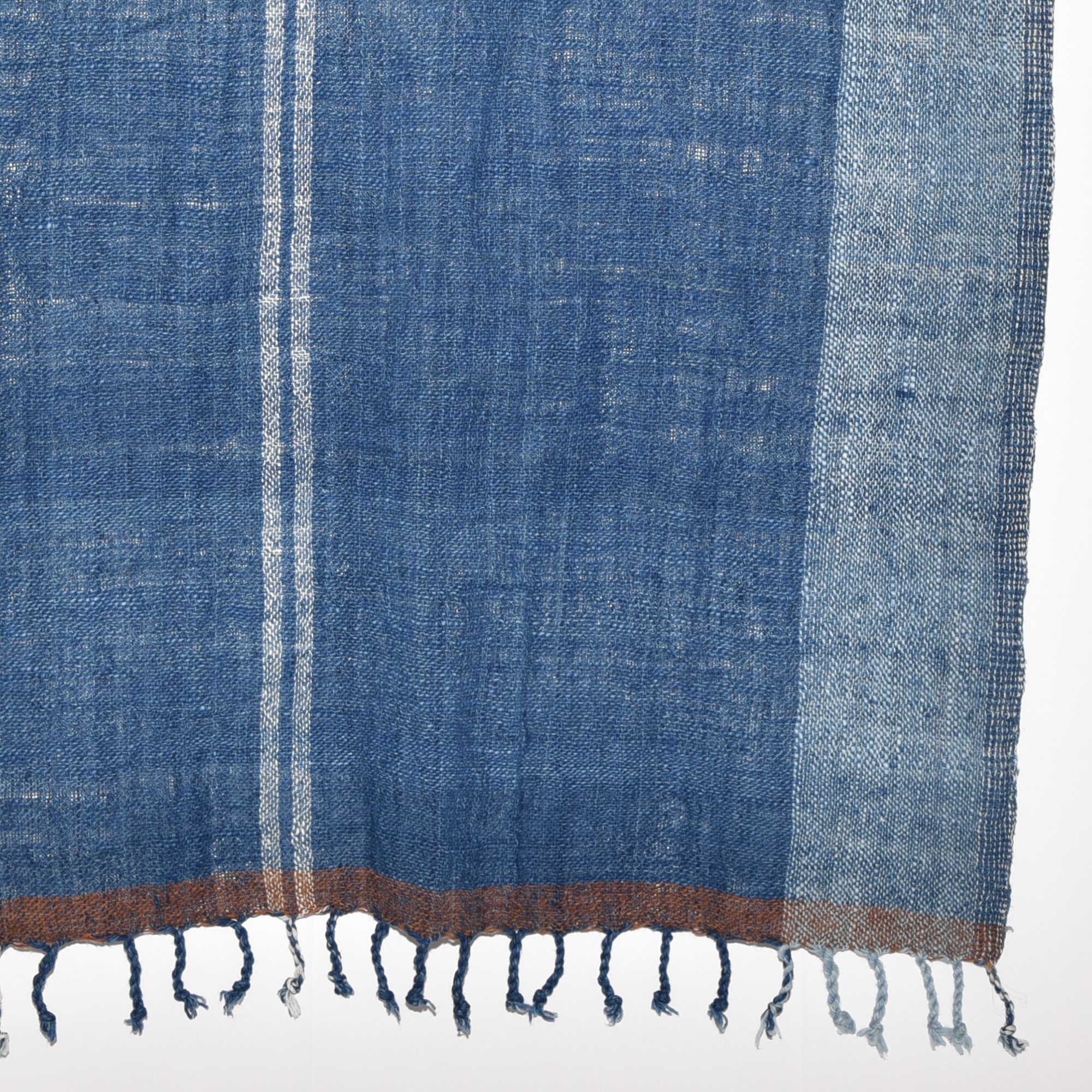 Hand-spun, hand-dyed, and hand-woven indigo and white striped organic cotton shawl with tassels, measuring 2m x 80cm.