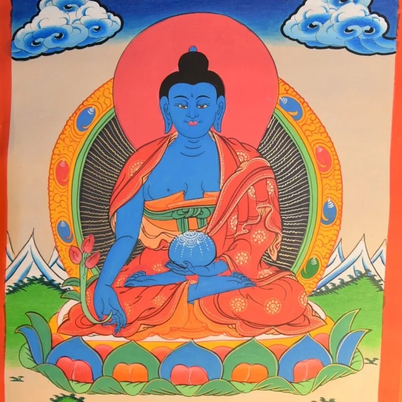picture of blue buddha sitting in the lotus position on a lotus