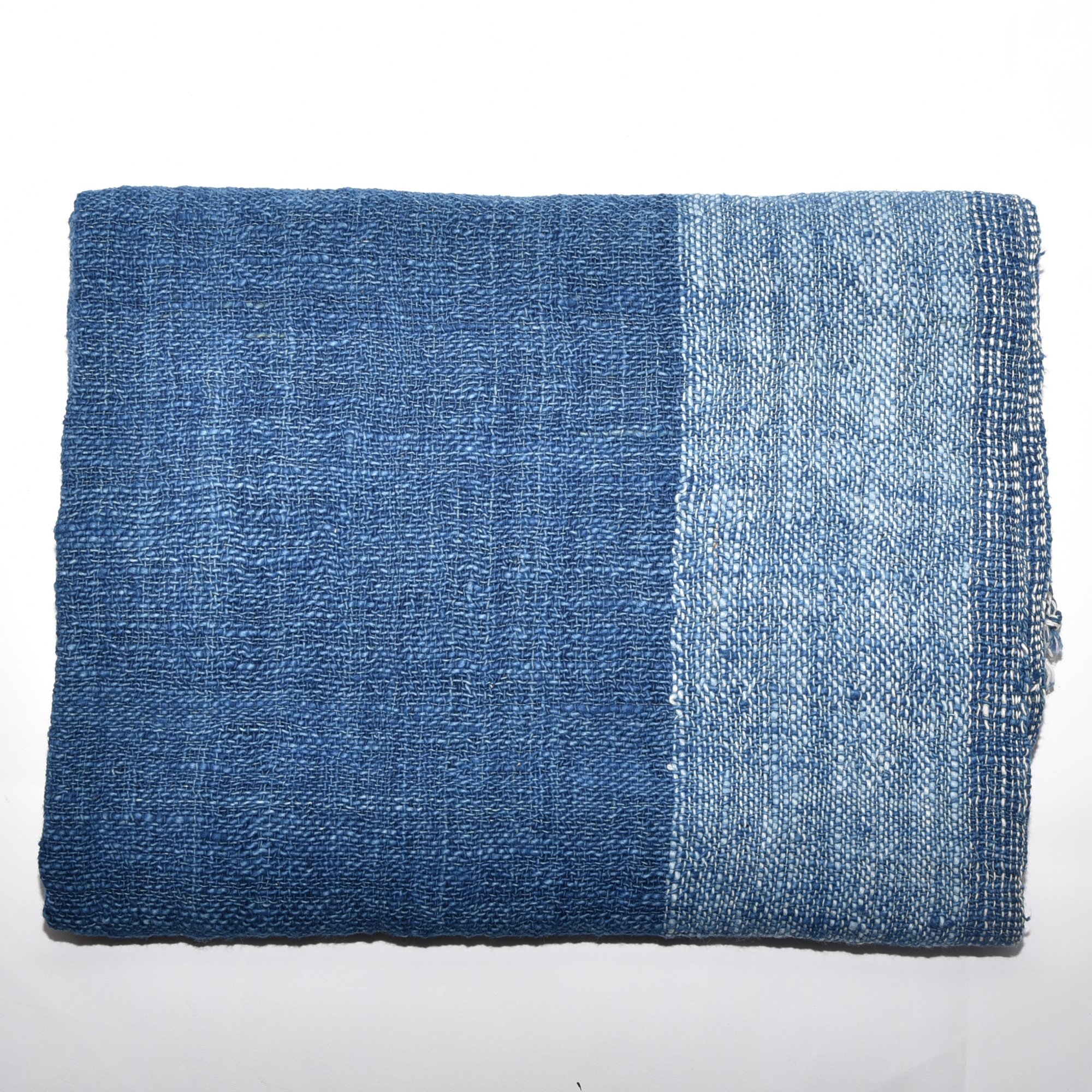 Hand-spun, hand-dyed, and hand-woven indigo and white striped organic cotton shawl with tassels, measuring 2m x 80cm.