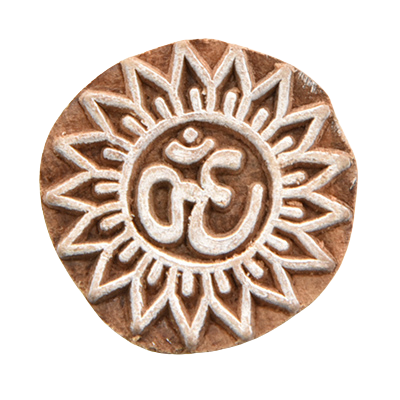 Small hand-carved Indian wooden printing block with the sacred 'Om' symbol.