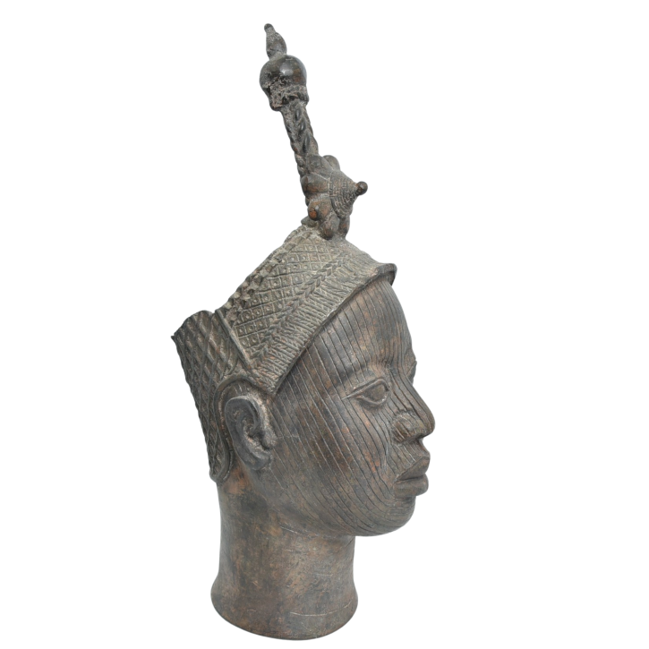 Detailed bronze sculpture of a woman's head with a crown, depicting an Ife Queen from Benin's rich cultural heritage.
