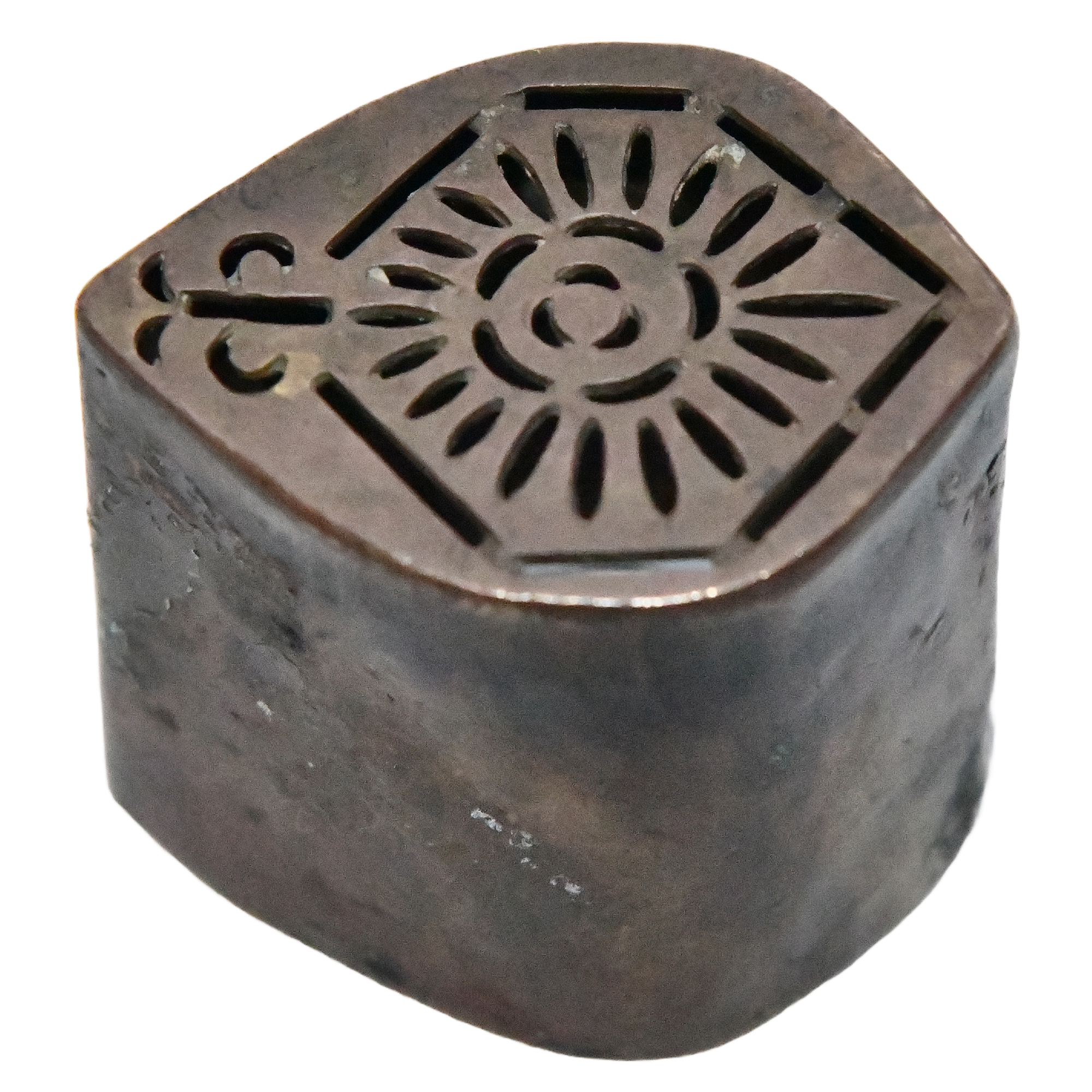 A brass rangoli from India, Rajasthan, dating back to the early 20th century. It's intricately designed and measures approximately 4cm long, 3.5cm wide, and 4.5cm deep. The rangoli weighs 39 grams.