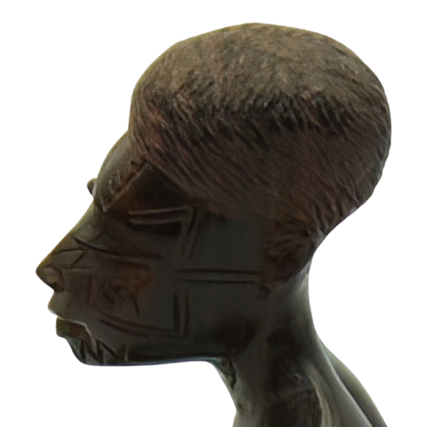 Head shot of a Besmo Maasai ebony Figure facing east.png